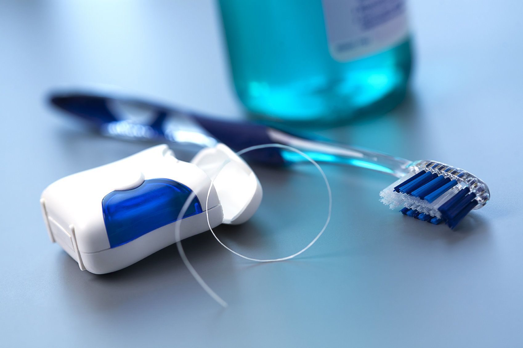 Dental floss and toothbrush.